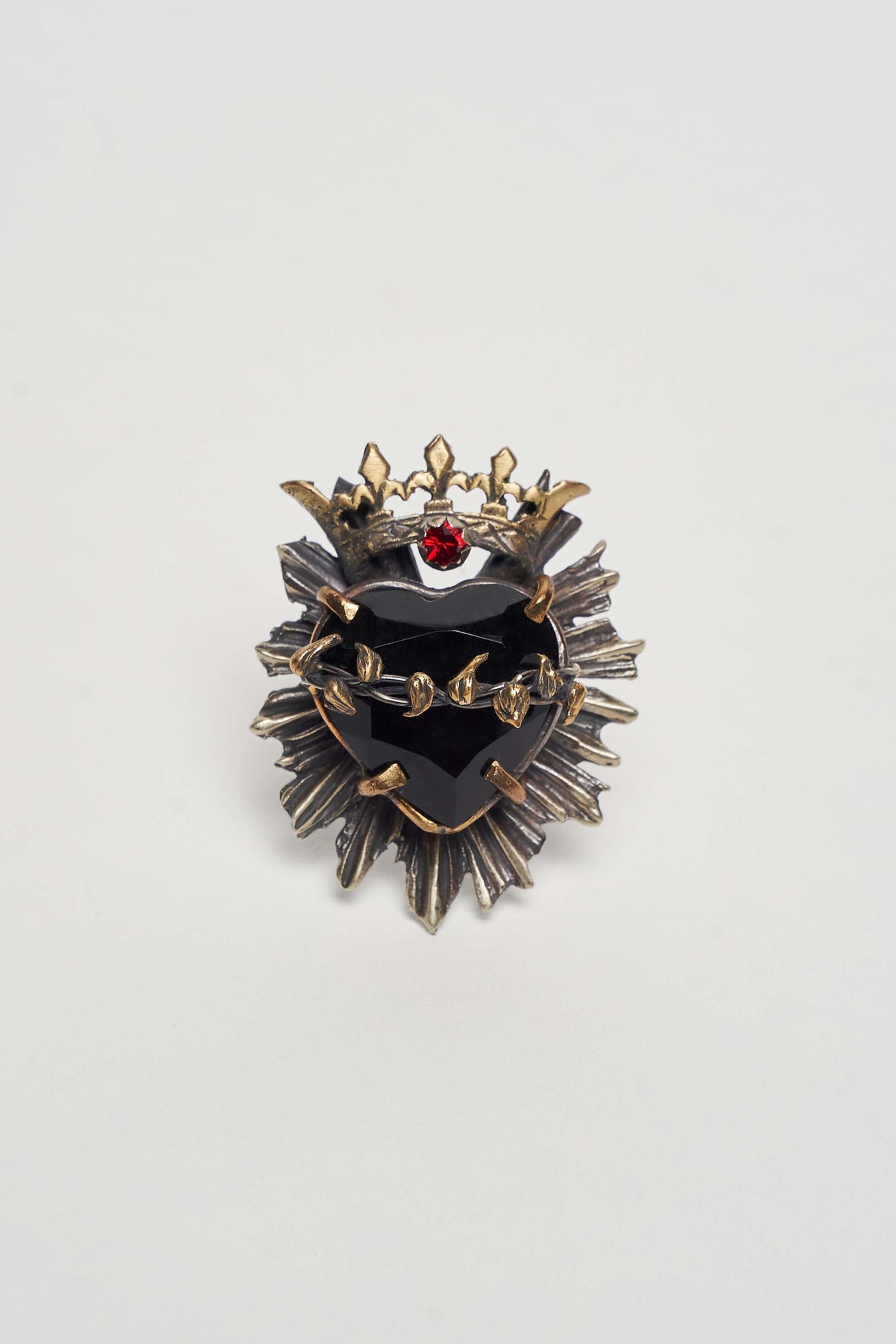 SAGRADO CORAZON CROWN RING WITH HAND-FACETED BLACK HEART AND RED CRYSTAL